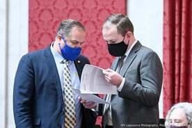 Picture of Clay Riley and Ben Queen reviewing documents during the 2022 session