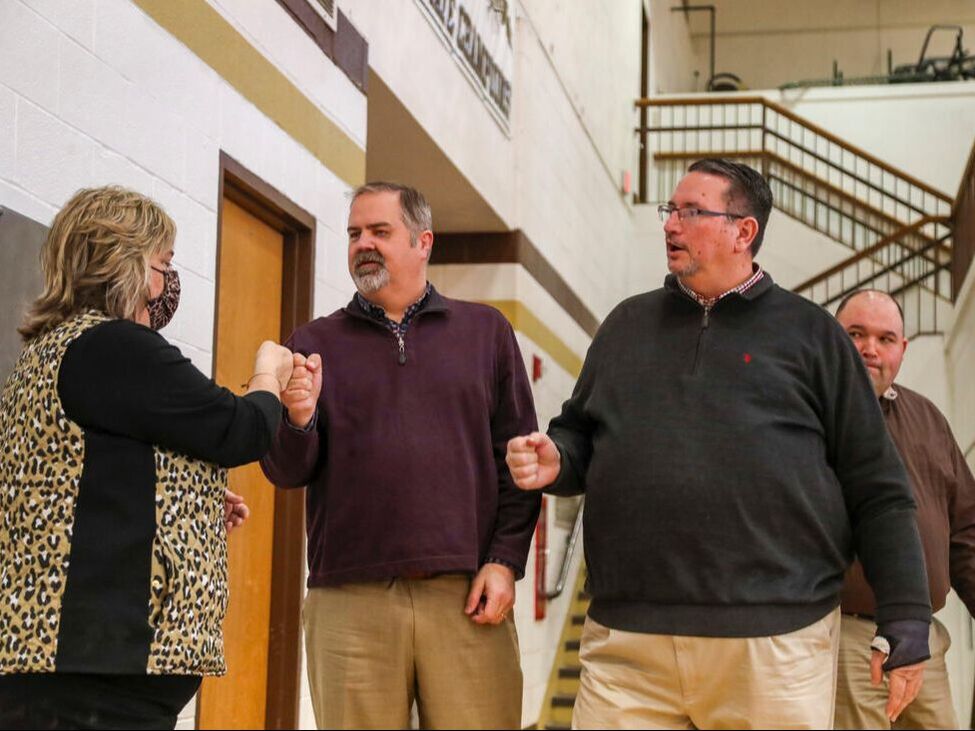 Photo of Basketball Coaches before a Lincoln High School Game, Clay Riley, Rob Hawkins and Holly Hawkins